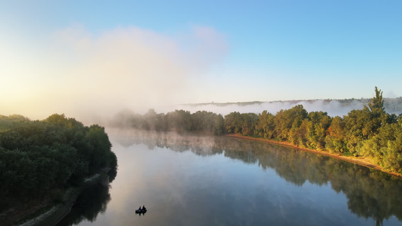 Aerial drone view of nature of Moldova at sunset. River and lush fog above it greenery
