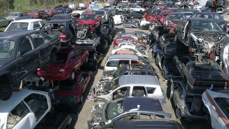 aerial view of a junkyard and large group of wrecked cars