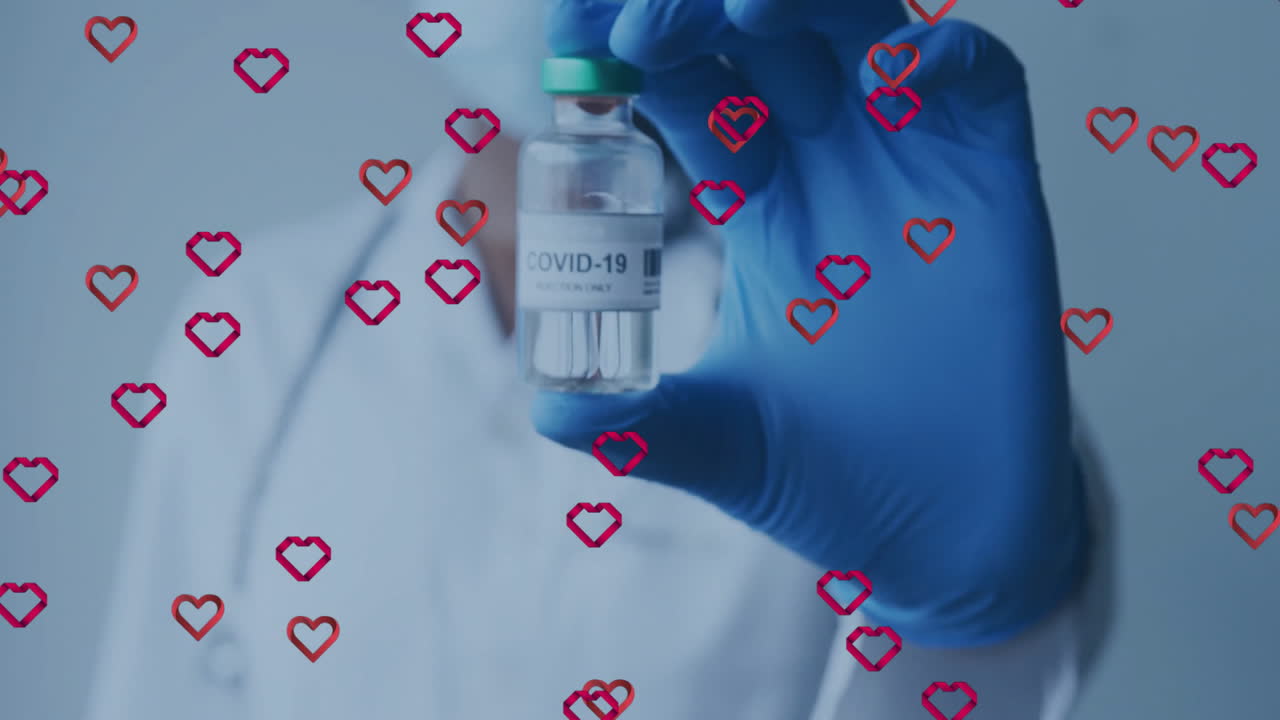 Healthcare professional holding COVID-19 vaccine vial in medical lab, with floating heart icons