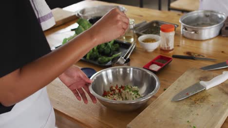 Diverse-group-of-chefs-preparing-dishes-and-smiling