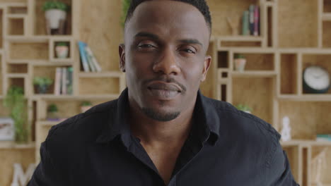 close up portrait of serious young masculine african american man looking confident intense at camera