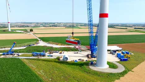 Construction-Site-During-Installation-Of-Wind-Turbine---drone-shot