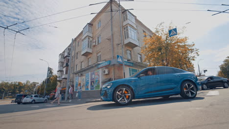 audi e-tron first all-electric suv car. presentation of a new car model. fast driving drifting in city