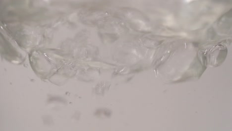 slow motion footage of water splashes in bottle