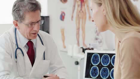 Handheld-view-of-worried-woman-during-visit-at-the-doctor