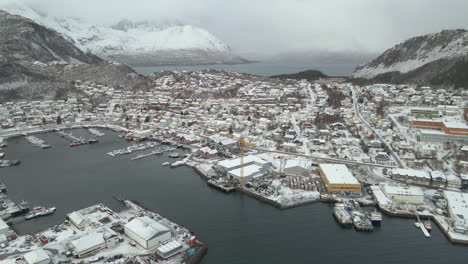 Freezing-winter-weather-with-snow-over-Skjervoy-village-in-Northern-Norway,-aerial