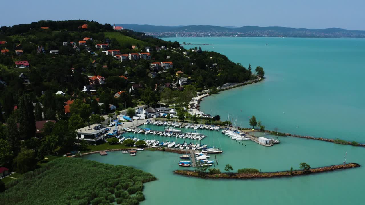 Medium altitude moving forward areial 4K footage over the tihany's harbor at Lake Balaton.