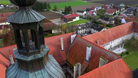 roofs and courtyard of hartheim castle in upper austria - drone shot