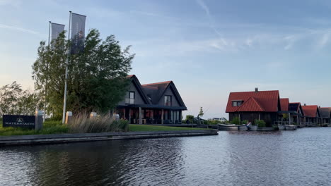 tranquil scenery and villas of holiday park waterstaete ossenzijl in the netherlands - pov