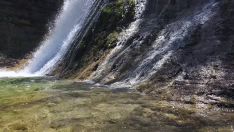 Experience-the-serene-beauty-of-a-cascading-waterfall-captured-by-a-stationary-camera