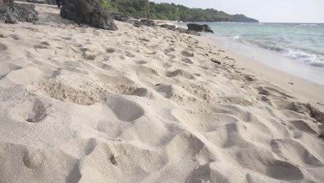 cinematic shot of a white sand beach in a tropical country of the philippines