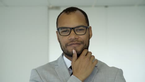 confident smiling young man looking at camera