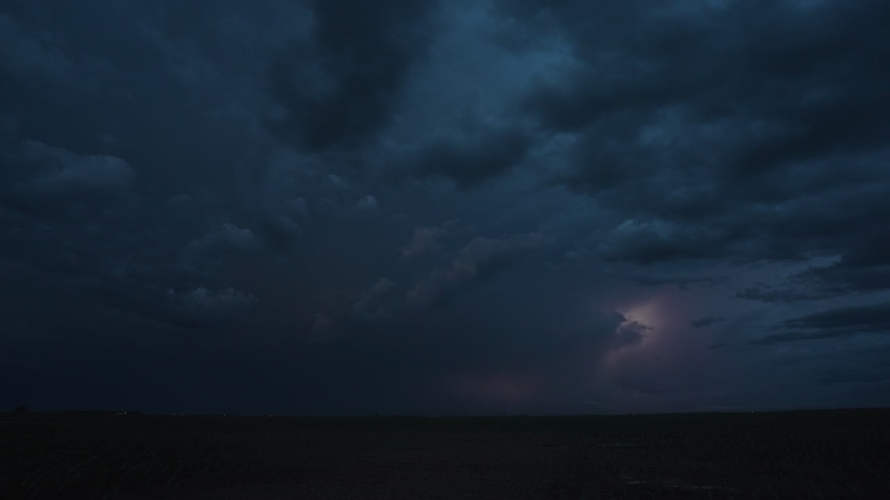 Amazing lightning lights up the night above open fields