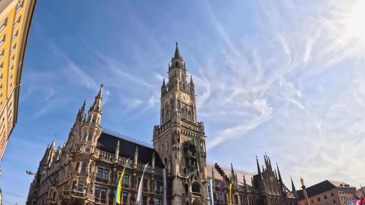 Admiring Munich’s majestic Marienplatz Town Hall architecture in the city centre on a sunny day.