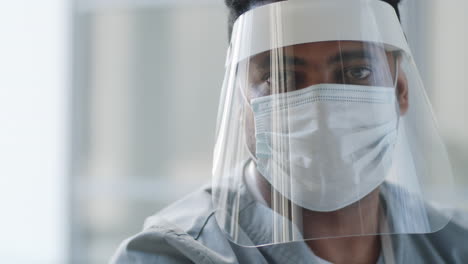 Portrait-of-Doctor-in-Face-Shield-and-Mask-at-Work