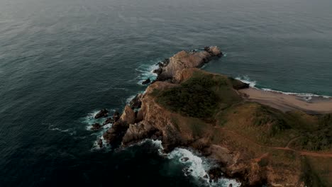 parralax shot of a rocky island near oaxacan coast, mazunte oaxaca, mexico