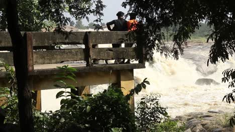 pan shot revealing a person watching waterfall at usri falls in giridih, jharkhand, india on tuesday 6th october, 2020