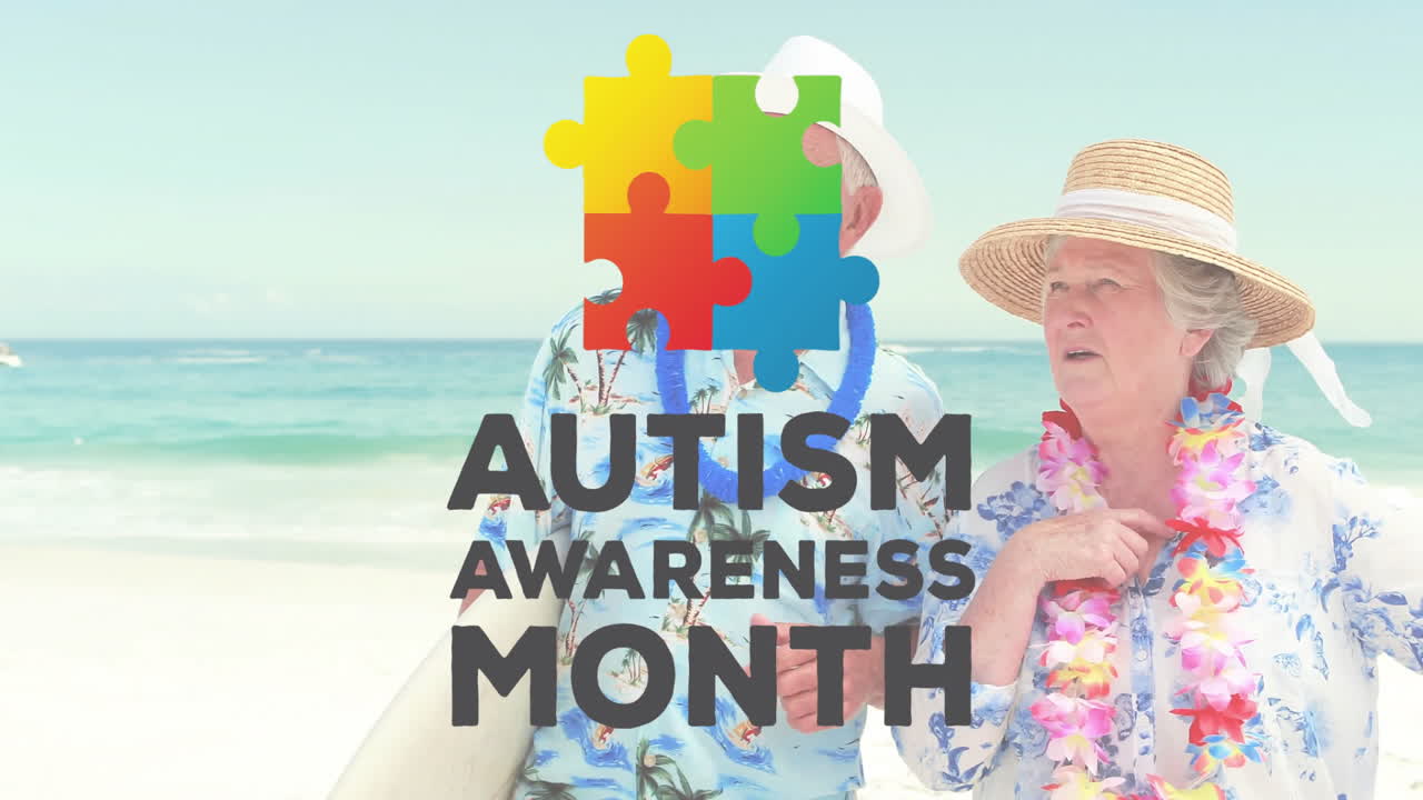 Wearing beach attire, elderly couple with Autism Awareness Month puzzle piece logo