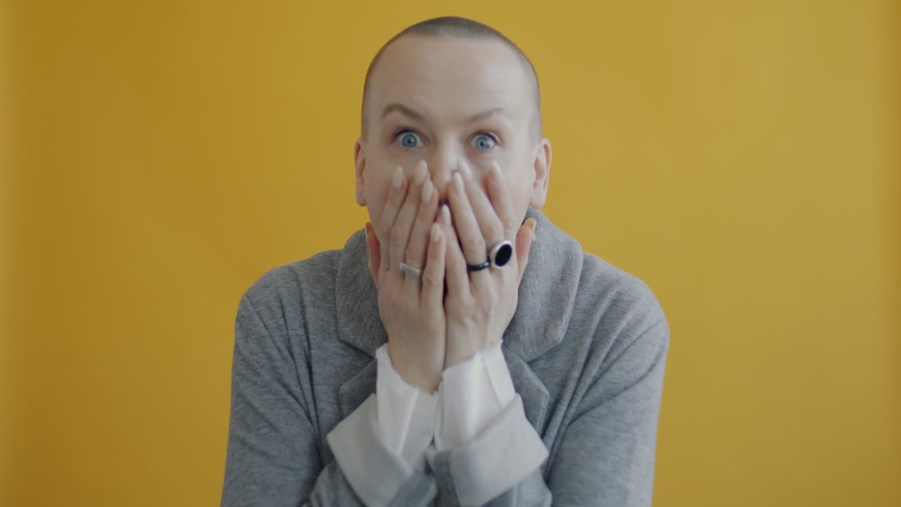 Woman with Open Mouth and Hands Up