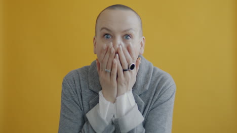 woman with open mouth and hands up