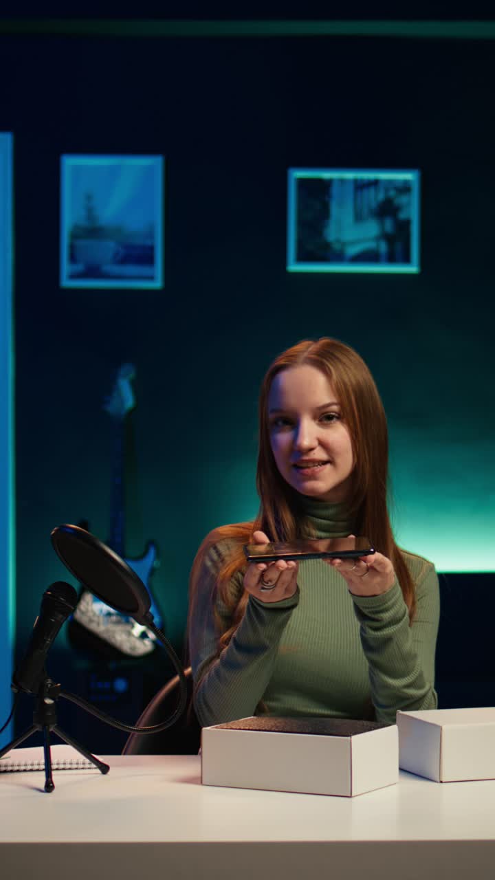 Young Woman Unboxing New Smartphone in Studio