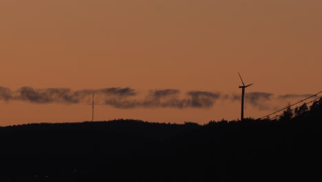 wind power generator turbine, at a sunny evening dusk, in hoga kusten, vasternorrland, sweden