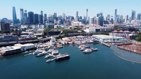 Aerial-drone-landscape-view-of-Sydney-Fish-Market-Blackwattle-Bay-boats-in-harbour-buildings-travel-tourism-Sydney-City-CBD-NSW-Australia-4K