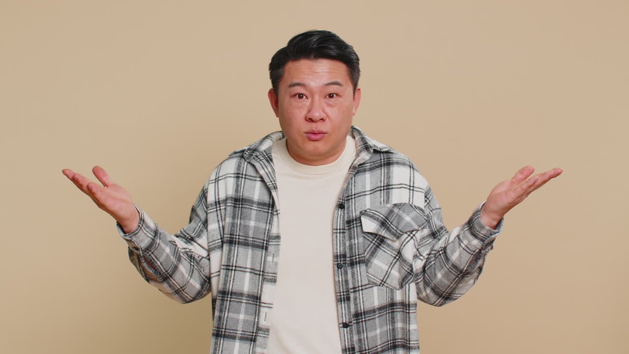 Asian man being uninvolved clueless face expression feels innocent not his fault fail mistake