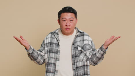 asian man being uninvolved clueless face expression feels innocent not his fault fail mistake