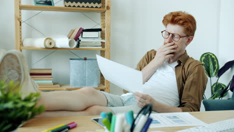 man relaxing at his home office