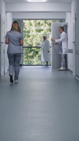 hospital corridor with medical professionals and patients