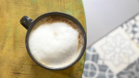 cup of cappuccino on a table