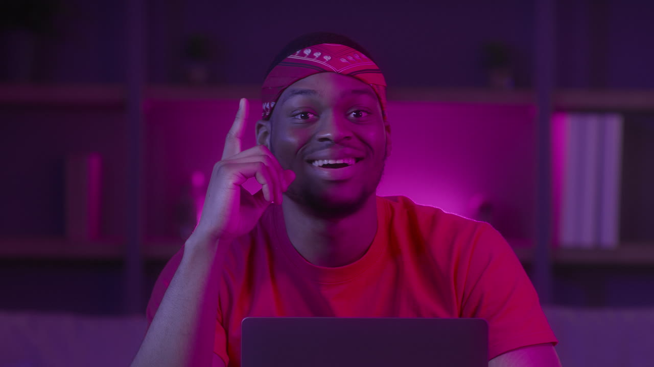 Young Man at Laptop in Night Room