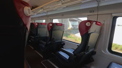 empty train seats with scenic countryside views