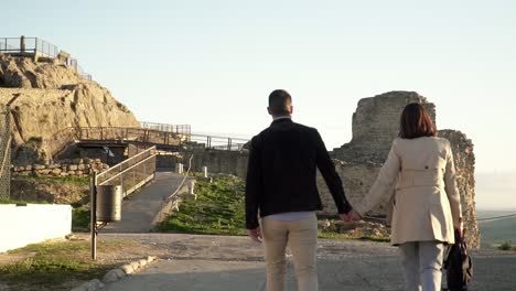 slowmotion shot of a couple holding hands heading to medina sidonia cadiz españa