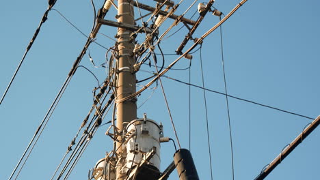 electrical net of poles against the blue sky