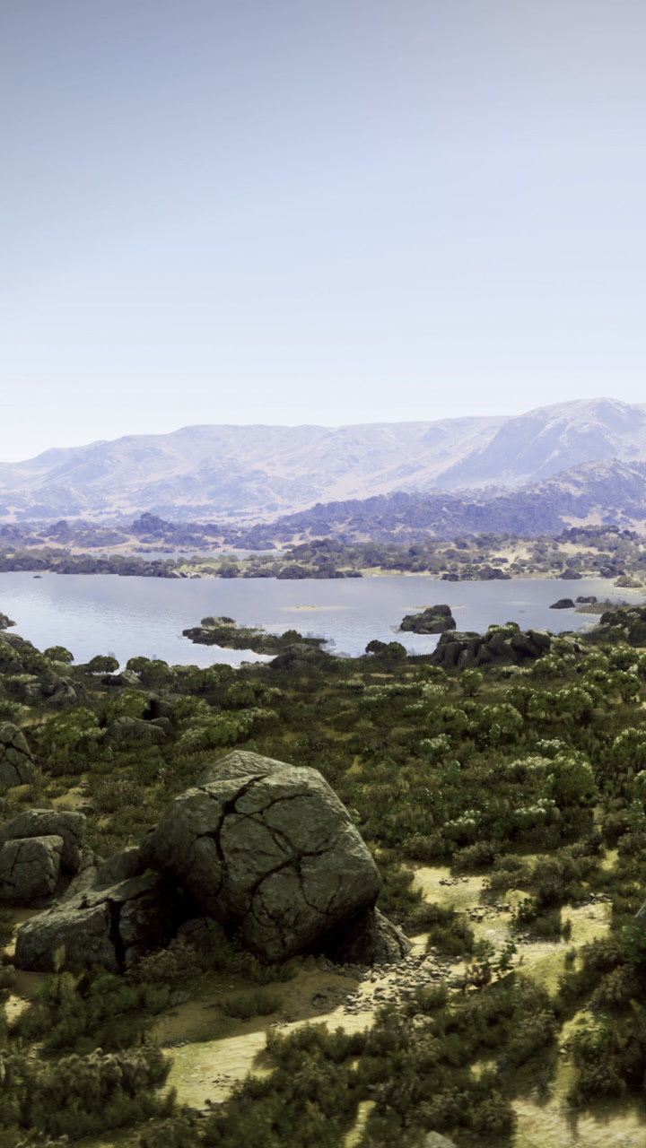 Scenic view of a lake surrounded by mountains and rocks in daylight