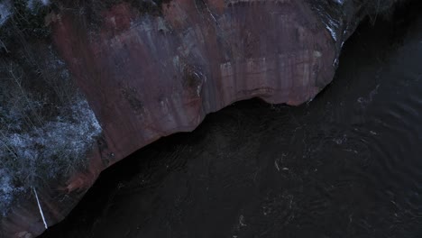 Take-off-of-cliff-near-Gauja-river-in-Latvia-during-winter