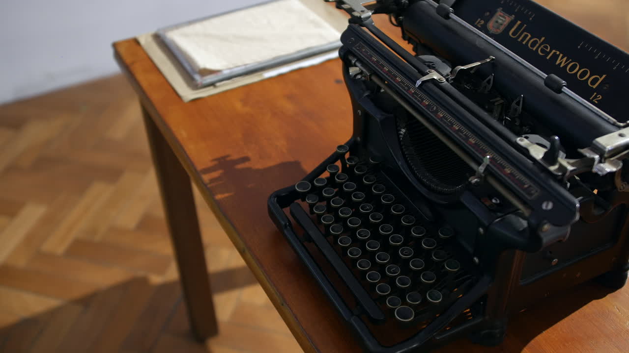 A 1930s retro wartime cast iron vintage Underwood typewriter on a desk in a second world war typing office