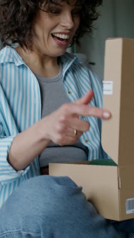 woman unboxing a gift