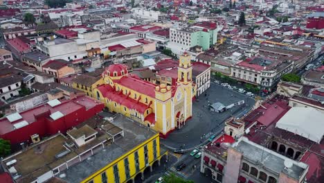 Aerial-drone-tilt-up-shot-over-Metropolitan-Cathedral-of-the-Immaculate-Conception-of-Xalapa,-Xalapa-city,-Veracruz,-Mexico-at-daytime