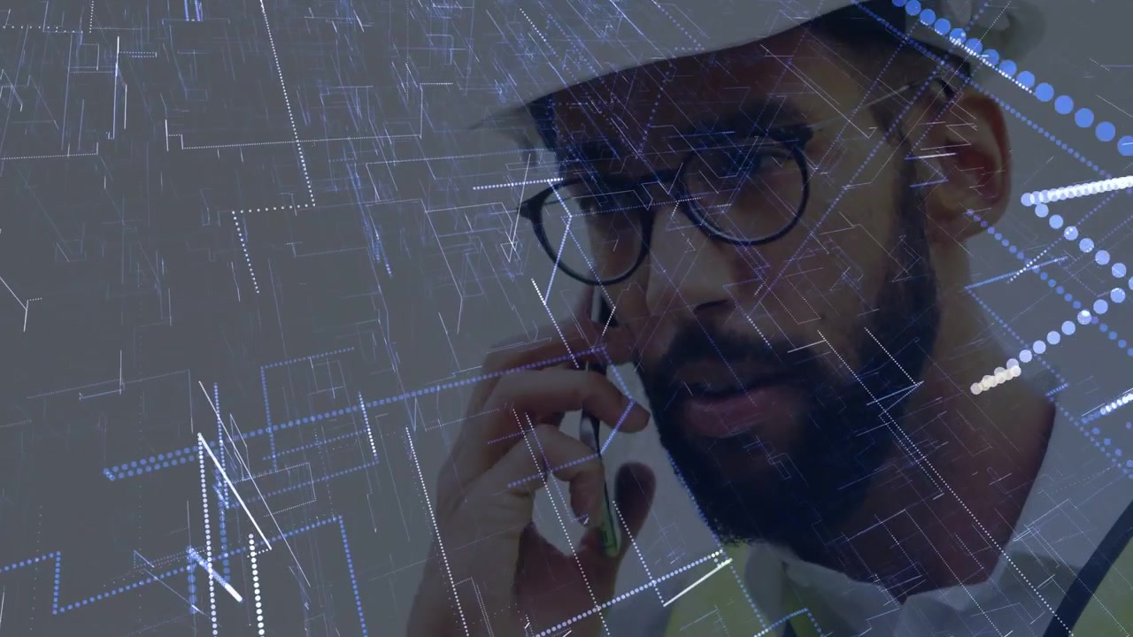 Male construction worker tapping phone and rotating sensor, summoning data lines and calling team