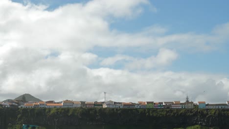 Colorful-houses-near-a-cliff-in-Azores