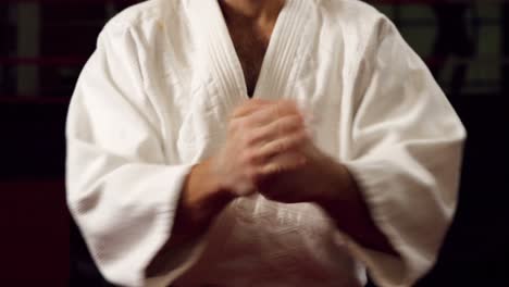 man practicing karate in fitness studio