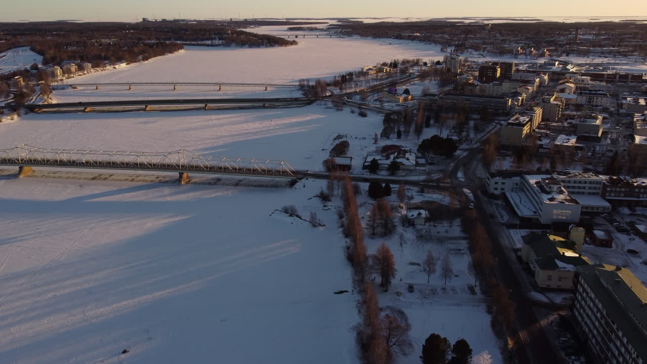 Bridges Over Frozen Snow-Covered River in Tornio Finland AERIAL