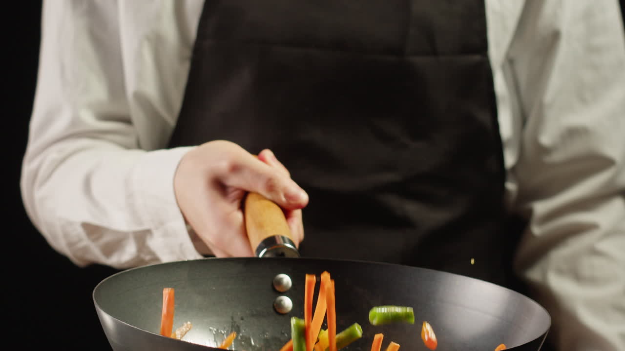 Chef Stir-Frying Vegetables in Wok