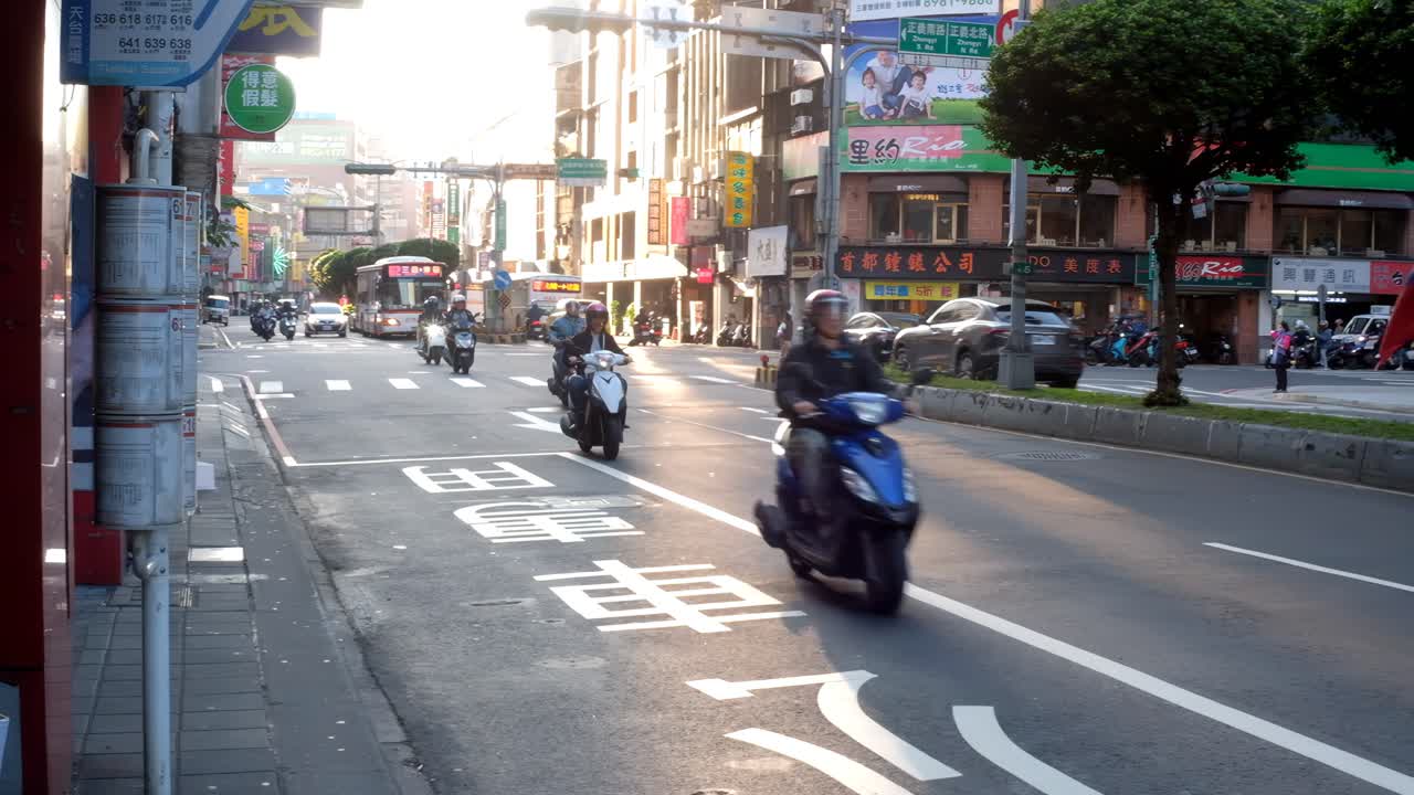 Busy City Street in Taiwan with Scooters and Local Transport