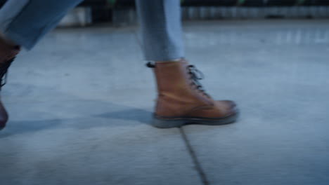 closeup warehouse employee boots specialist going to shipment cargo workplace