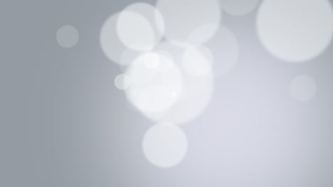 partículas blancas y bokeh redondo en un fondo brillante