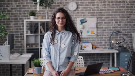 young woman designer in a modern office
